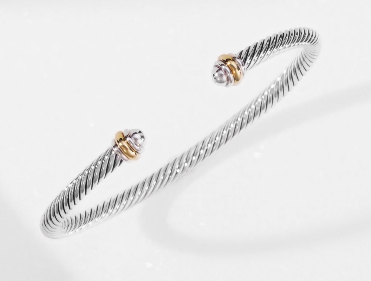 CLASSIC CABLE BRACELET
Sterling Silver with 18K Yellow Gold, 4mm